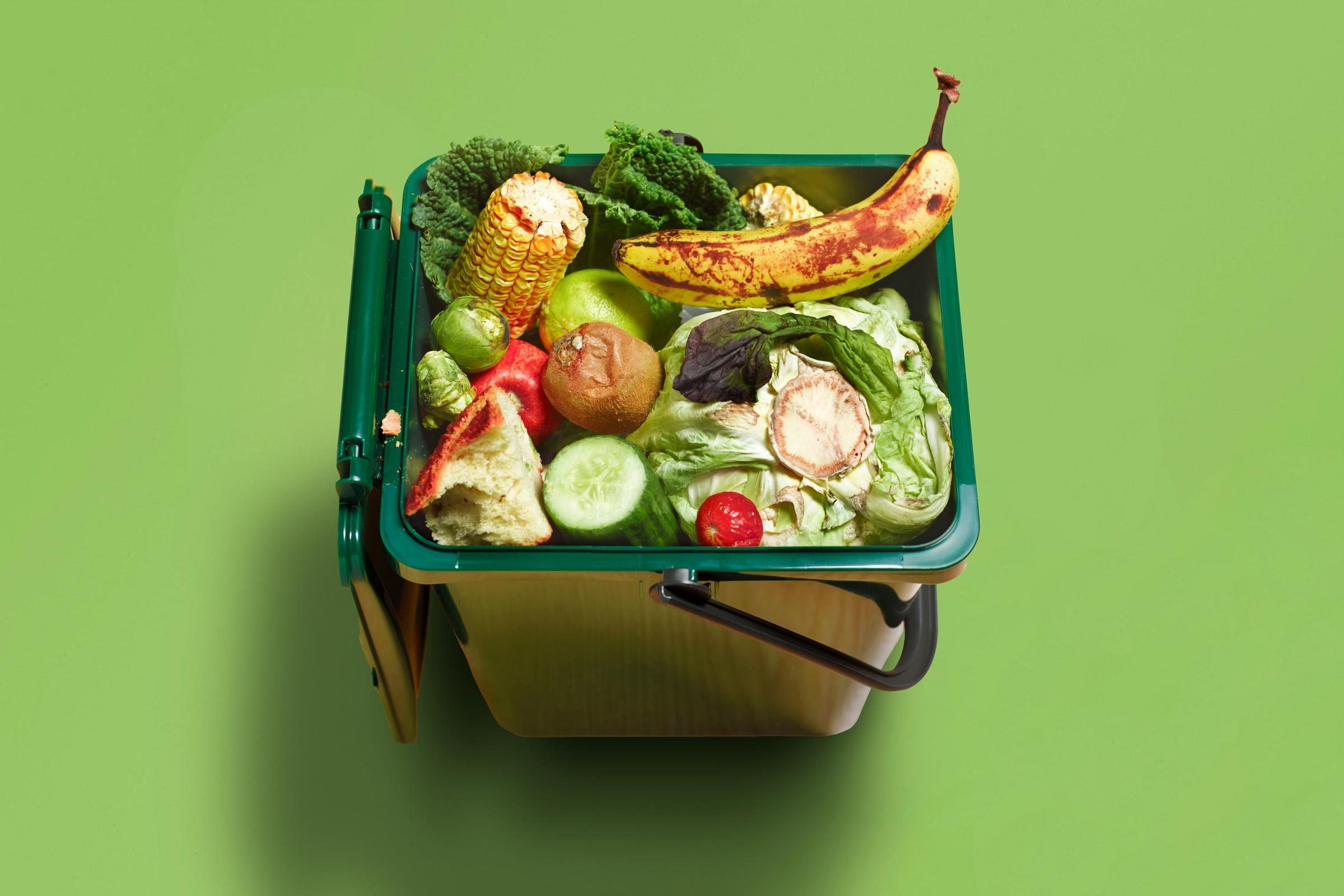 Kitchen Compost bucket on green backdrop